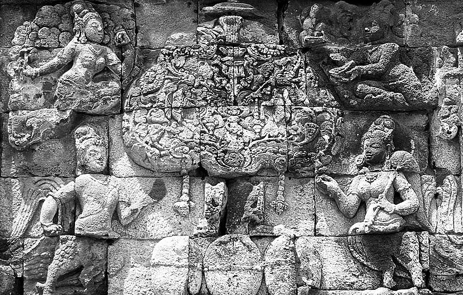 Kalpataru, the divine tree of life being guarded by mythical creatures at the 8th century Pawon temple, a Buddhist temple in Java, Indonesia.